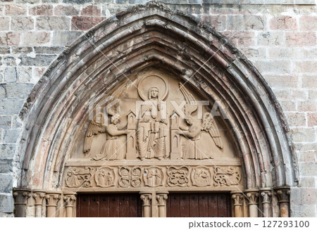 Discovering the carved entrance of a historic church in Roncesvalles along the Camino de Santiago Discovering the carved entrance of a historic church in Roncesvalles along the Camino de Santiago 127293100