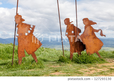 Metal sculptures of pilgrims on Alto del Perdon on the Camino de Santiago surrounded by scenic landscape Metal sculptures of pilgrims on Alto del Perdon on the Camino de Santiago surrounded by scenic landscape 127293130