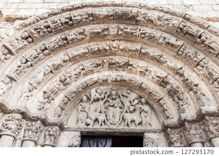 Intricate medieval stone carvings adorning the entrance of a historic church in Europe Intricate medieval stone carvings adorning the entrance of a historic church in Europe 127293170