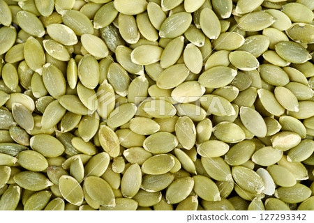 Full frame of peeled pumpkin seeds as background or texture. Full frame of peeled pumpkin seeds as background or texture. 127293342