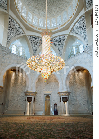 View of Sheikh Zayed Grand Mosque in Abu Dhabi. Inside mosque with famous huge seamless carpet. Vertical photo 127294172