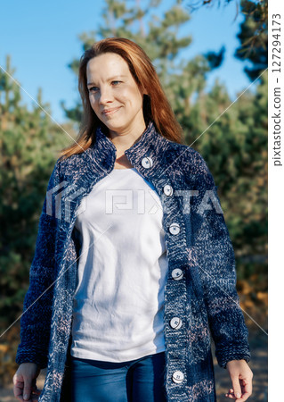Female portrait. Beautiful young girl with long dark hair on a sunny autumn day outdoors. Vertical photo. High quality photo Female portrait. Beautiful young girl with long dark hair on a sunny autumn day outdoors. Vertical photo. High quality photo 127294173