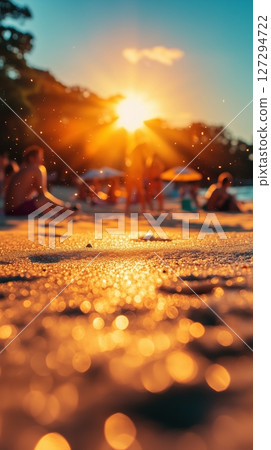 People enjoy a sunny beach vacation with golden sands and vibrant activities during sunset 127294722