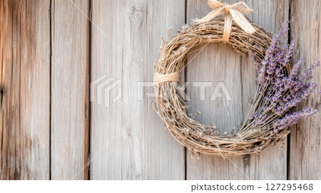 Cottagecore rustic wreath on weathered barn creating charming farmhouse atmosphere 127295468