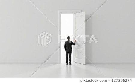 A person approaching an open door in a minimalist space. 127296274