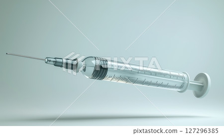 Syringe floating against a soft, neutral background. Syringe floating against a soft, neutral background. 127296385
