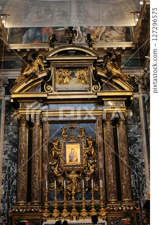 Gold enshrined icon of Salus Populi Romani flanked by ornate Corinthian columns gilded sculptures and decorative marble wall in Basilica of Saint Mary Major Rome Italy. High quality photo Gold enshrined icon of Salus Populi Romani flanked by ornate Corinthian columns gilded sculptures and decorative marble wall in Basilica of Saint Mary Major Rome Italy. High quality photo 127296575