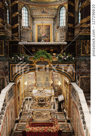 Relic of the Holy Crib also known as the manger where Jesus was laid on display in the sculptural crypt beneath the altar of Basilica of Saint Mary Major in Rome decorated with Christmas garlands 127296610