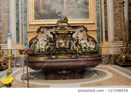 Ornate holy water font in Saint Peters Basilica with sculpted marble angels and basin below religious artwork representing purification and Catholic sacrament in Vatican City. High quality photo Ornate holy water font in Saint Peters Basilica with sculpted marble angels and basin below religious artwork representing purification and Catholic sacrament in Vatican City. High quality photo 127296659