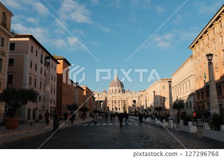 Morning view of Saint Peters Basilica Vatican City with symmetrical Renaissance architecture tourist walking in front historical religious landmark. High quality photo Morning view of Saint Peters Basilica Vatican City with symmetrical Renaissance architecture tourist walking in front historical religious landmark. High quality photo 127296768