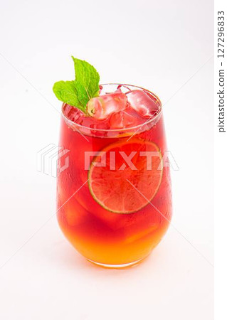 vibrant red citrus cocktail with blood orange slice and fresh mint served in clear glass over ice on white background. High quality photo vibrant red citrus cocktail with blood orange slice and fresh mint served in clear glass over ice on white background. High quality photo 127296833