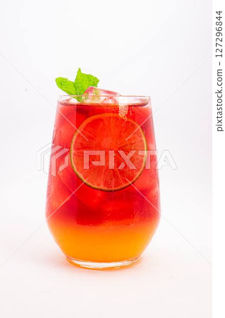 vibrant red citrus cocktail with blood orange slice and fresh mint served in clear glass over ice on white background. High quality photo vibrant red citrus cocktail with blood orange slice and fresh mint served in clear glass over ice on white background. High quality photo 127296844