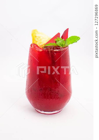 red beet or berry smoothie with pineapple slice and mint garnish served in transparent glass on white background. High quality photo red beet or berry smoothie with pineapple slice and mint garnish served in transparent glass on white background. High quality photo 127296869