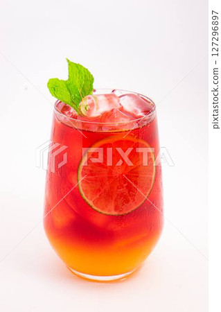 vibrant red citrus cocktail with blood orange slice and fresh mint served in clear glass over ice on white background. High quality photo vibrant red citrus cocktail with blood orange slice and fresh mint served in clear glass over ice on white background. High quality photo 127296897