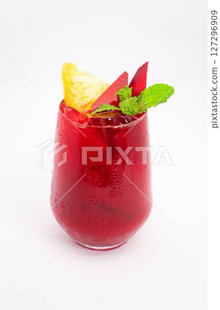 red beet or berry smoothie with pineapple slice and mint garnish served in transparent glass on white background. High quality photo red beet or berry smoothie with pineapple slice and mint garnish served in transparent glass on white background. High quality photo 127296909