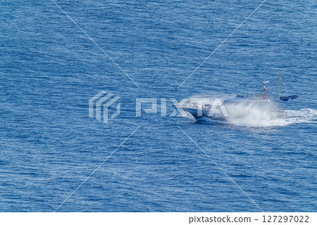 Scene of a ship speeding through the calm Sea of Japan Scene of a ship speeding through the calm Sea of Japan 127297022