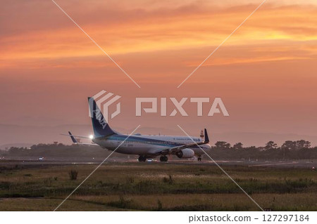 Sendai Airport at dusk, airplane taking off, Natori City, Miyagi Prefecture 127297184