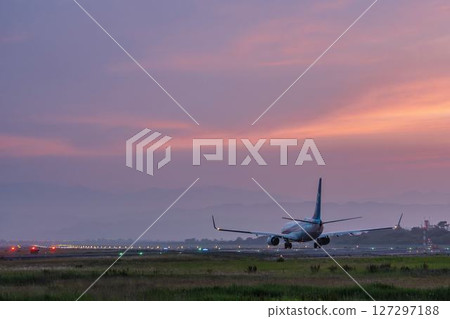 Sendai Airport at dusk, airplane taking off, Natori City, Miyagi Prefecture 127297188