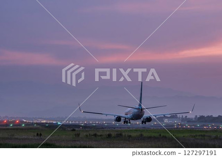 Sendai Airport at dusk, airplane taking off, Natori City, Miyagi Prefecture 127297191