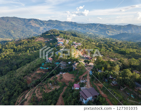 Aerial view of small village situated on mountain nearly Phu Lung ka forest park in Phayao province of Thailand. 127301035