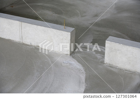 Remains of concrete surface finishing 127301064