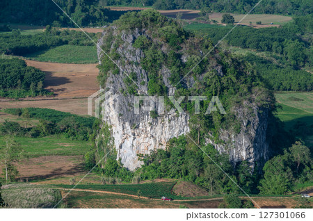 Scenery view of Pha Chang Noi an iconic limestone hill in Phu Lung ka forest park located in Phayao province of Thailand. 127301066
