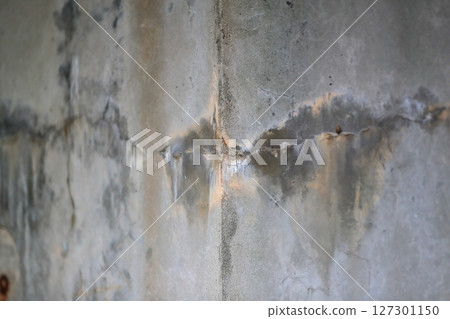 Cracks and efflorescence on concrete surface Cracks and efflorescence on concrete surface 127301150