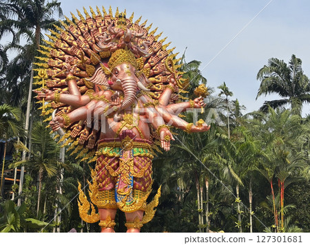 Pattaya, Thailand - May 29, 2025: At Nong Nooch Garden, a beautiful, huge statue of the Ganesha god, Sahasrabhuj Ganesha, stands with a thousand hands, surrounded by a natural background. 127301681