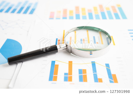 Magnifying glass on charts graphs paper. Financial development, Banking Account, Statistics, Investment Analytic research data economy. 127301998