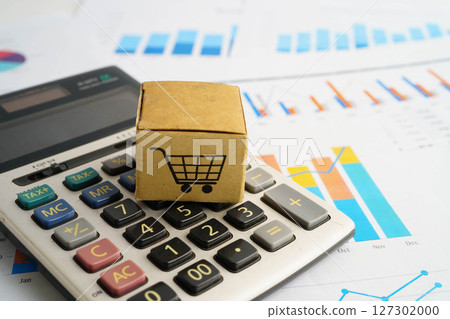 Online shopping, Shopping cart box on calculator, import export, finance commerce. 127302000