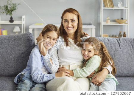 Happy Mother Sitting With Kids At Home For A Family Portrait Happy Mother Sitting With Kids At Home For A Family Portrait 127302607