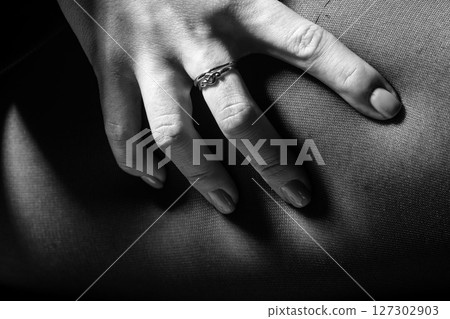 Abstract background of woman hand squeezing hip with black pantyhose 127302903