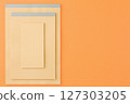 Sketchbooks on an orange background. 127303205