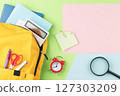 School backpack with educational supplies. 127303209
