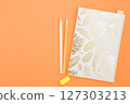 Craft notebook with colored pencils. 127303213
