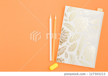 Craft notebook with colored pencils. Craft notebook with colored pencils. 127303213