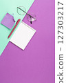 Spiral notepad with pen, note sheet and glasses. 127303217