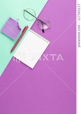 Spiral notepad with pen, note sheet and glasses. Spiral notepad with pen, note sheet and glasses. 127303217