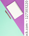 Spiral notepad with white pen. 127303220