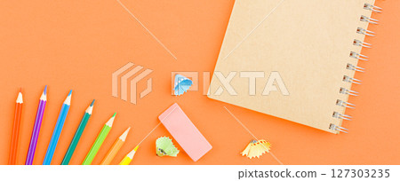 Spiral notepad with colored pencils. Spiral notepad with colored pencils. 127303235
