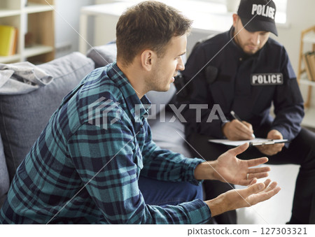 Policeman interrogating, officer police man in uniform, witness interview, interviewing suspected  127303321