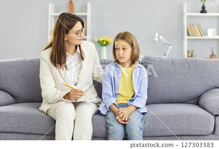 Psychologist Conducting Therapy Session With Sad Boy Offering Mental Support 127303383