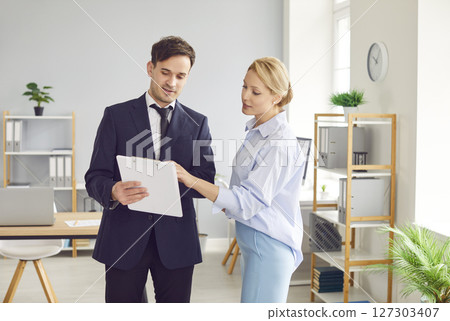 Successful Business Colleagues Discussing In Office Meeting Successful Business Colleagues Discussing In Office Meeting 127303407
