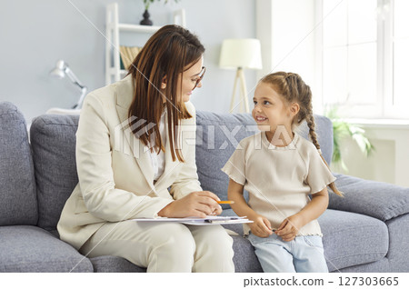 Doctor Psychologist And Girl In Therapy Session And Conversation Doctor Psychologist And Girl In Therapy Session And Conversation 127303665