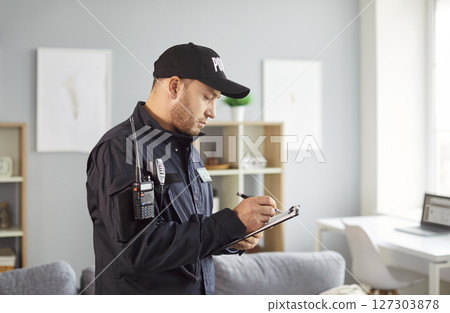 Policeman writing crime data report, statistic, interrogating victim or witnessed, officer police  127303878