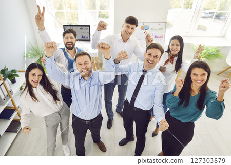 Business Team Portrait With Raised Hands In Office 127303879