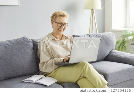 Senior Woman Working Or Enjoying Leisure Online At Home Senior Woman Working Or Enjoying Leisure Online At Home 127304136