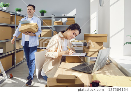 Young business woman laptop working online, individual seller starting small business  127304164