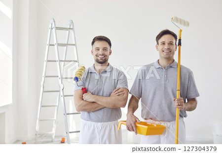 Portrait Of Two Happy Male Painters Working During Home Renovation 127304379