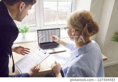 Back View Of Business Coworkers Working With Laptop In Office 127304483